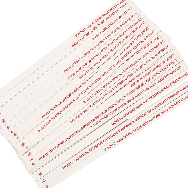 Fan of printed conversation starter sticks with holiday questions in red lettering