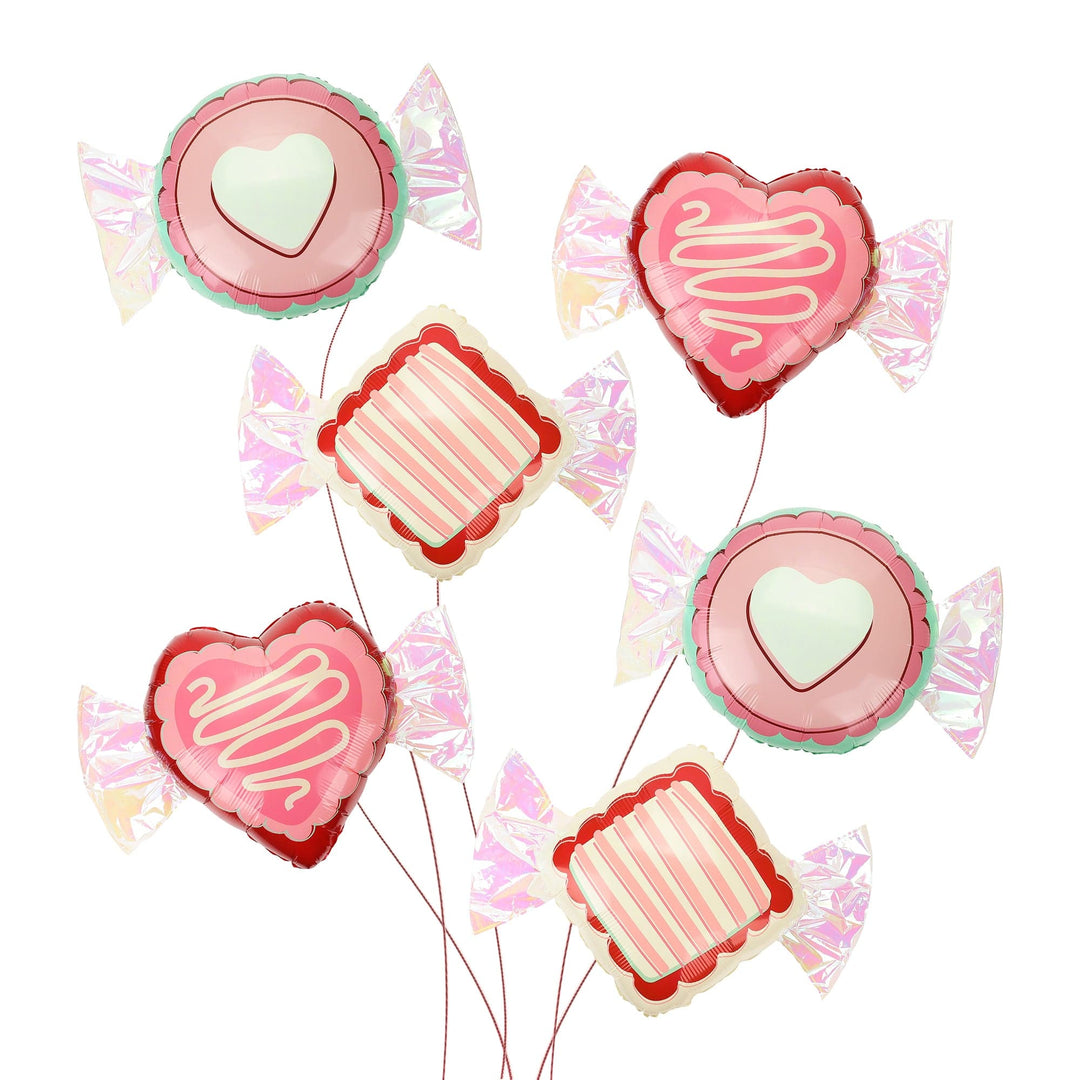 Six Valentine candy shaped balloons in heart, circle, and square with silver iridescent foil