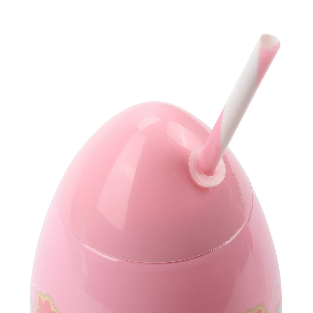 Close-up of the top of the pink egg sipper with its striped straw
