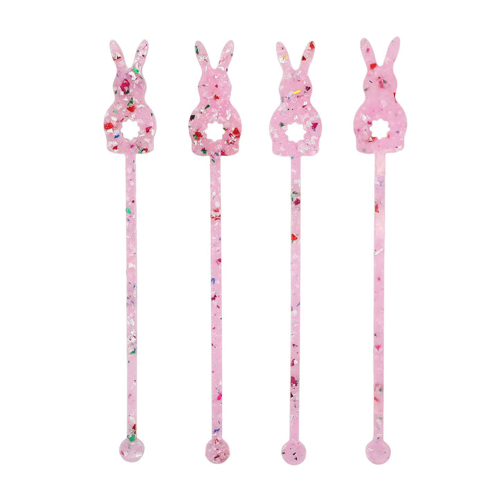 Four bunny shaped drink stirrers in clear pink acrylic filled with confetti and glitter
