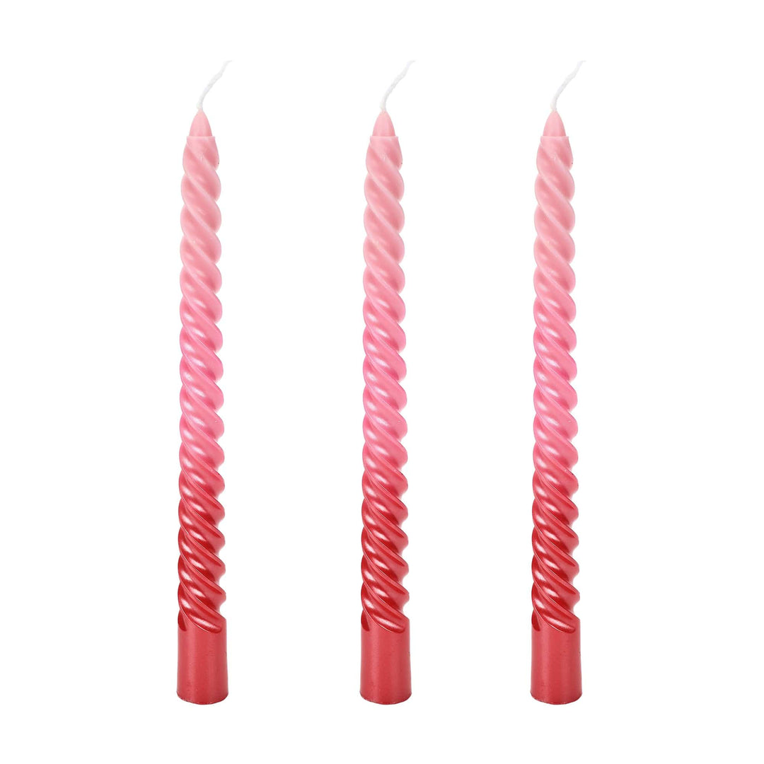 Twisted taper candles in a blush to rose pink ombre with a glossy finish