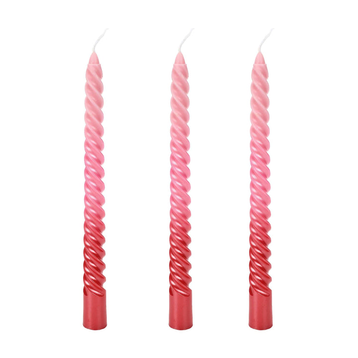 Twisted taper candles in a blush to rose pink ombre with a glossy finish