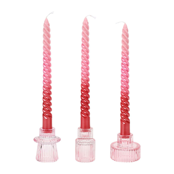 Blush and rose twisted taper candles with a sculptural spiral silhouette