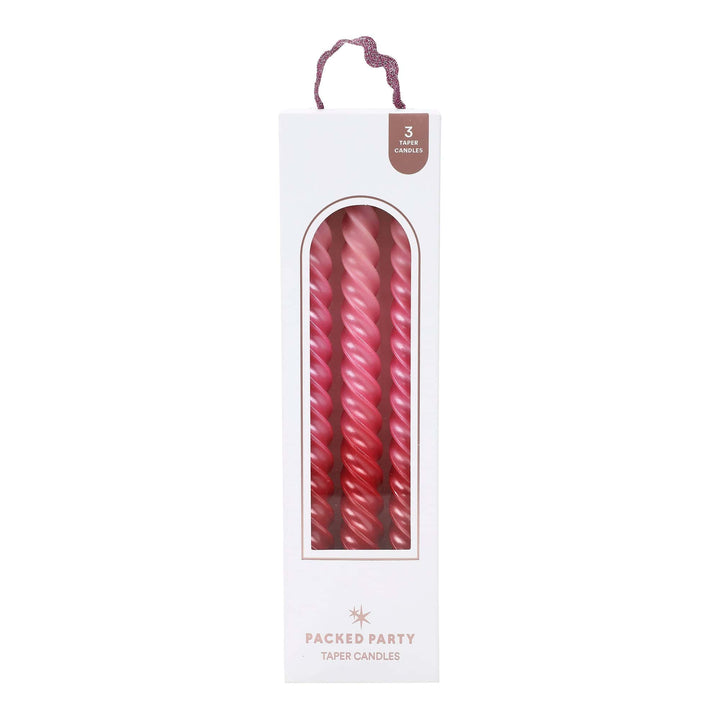 Twisted taper candles in a blush to rose pink ombre with a glossy finish