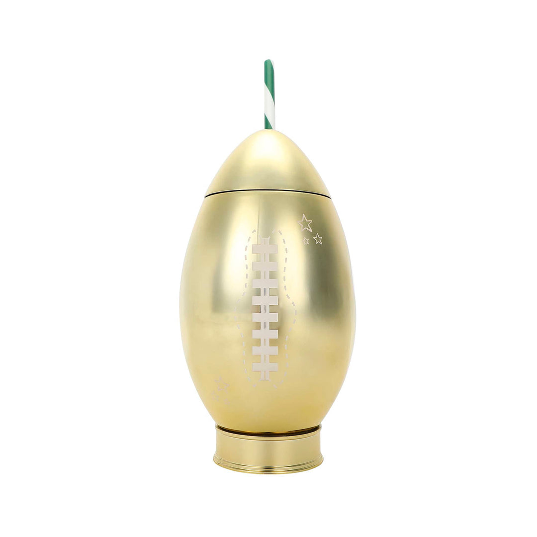 Gold football sipper cup with white laces and a green and white striped straw