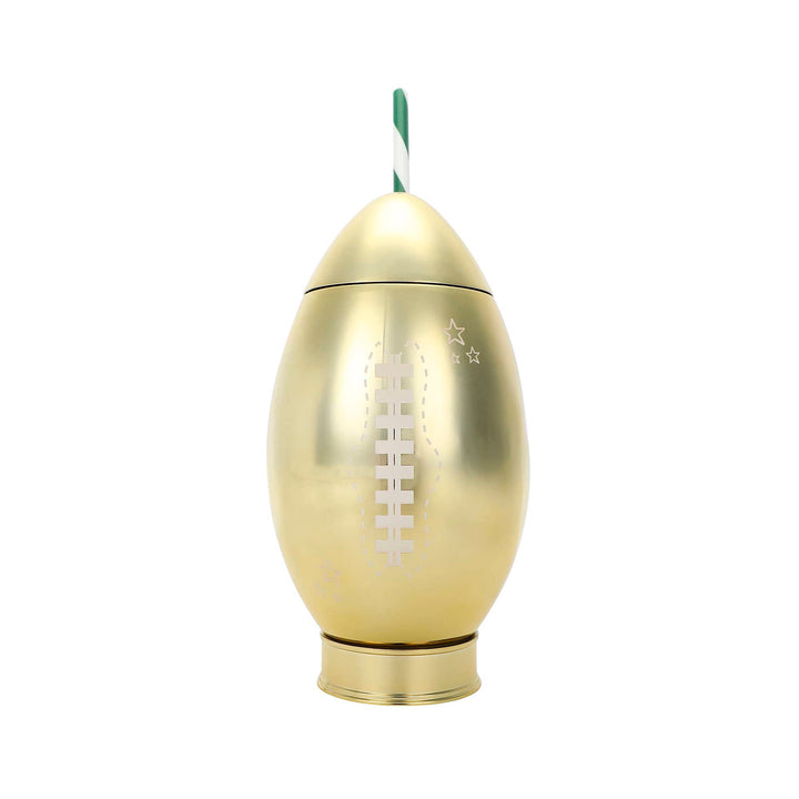 Gold football sipper cup with white laces and a green and white striped straw