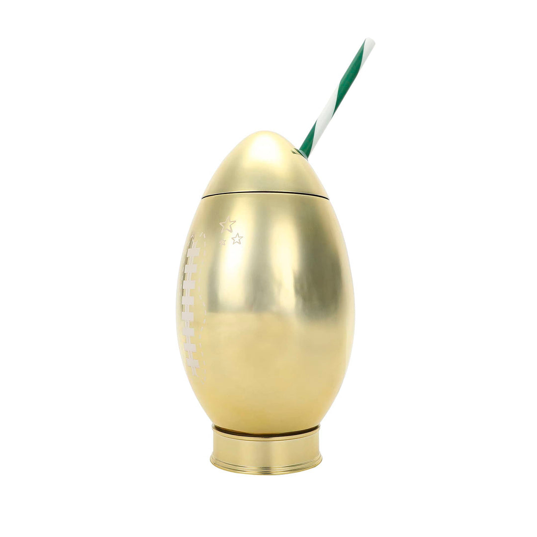 Gold football sipper with its lid on and a striped straw, shown from the side