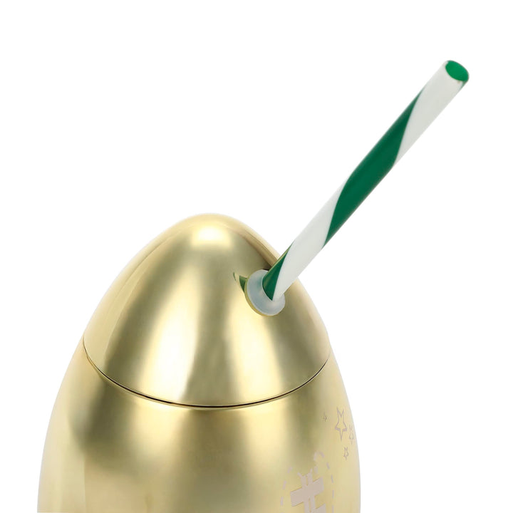 Close-up of the gold football cup lid with the green striped straw