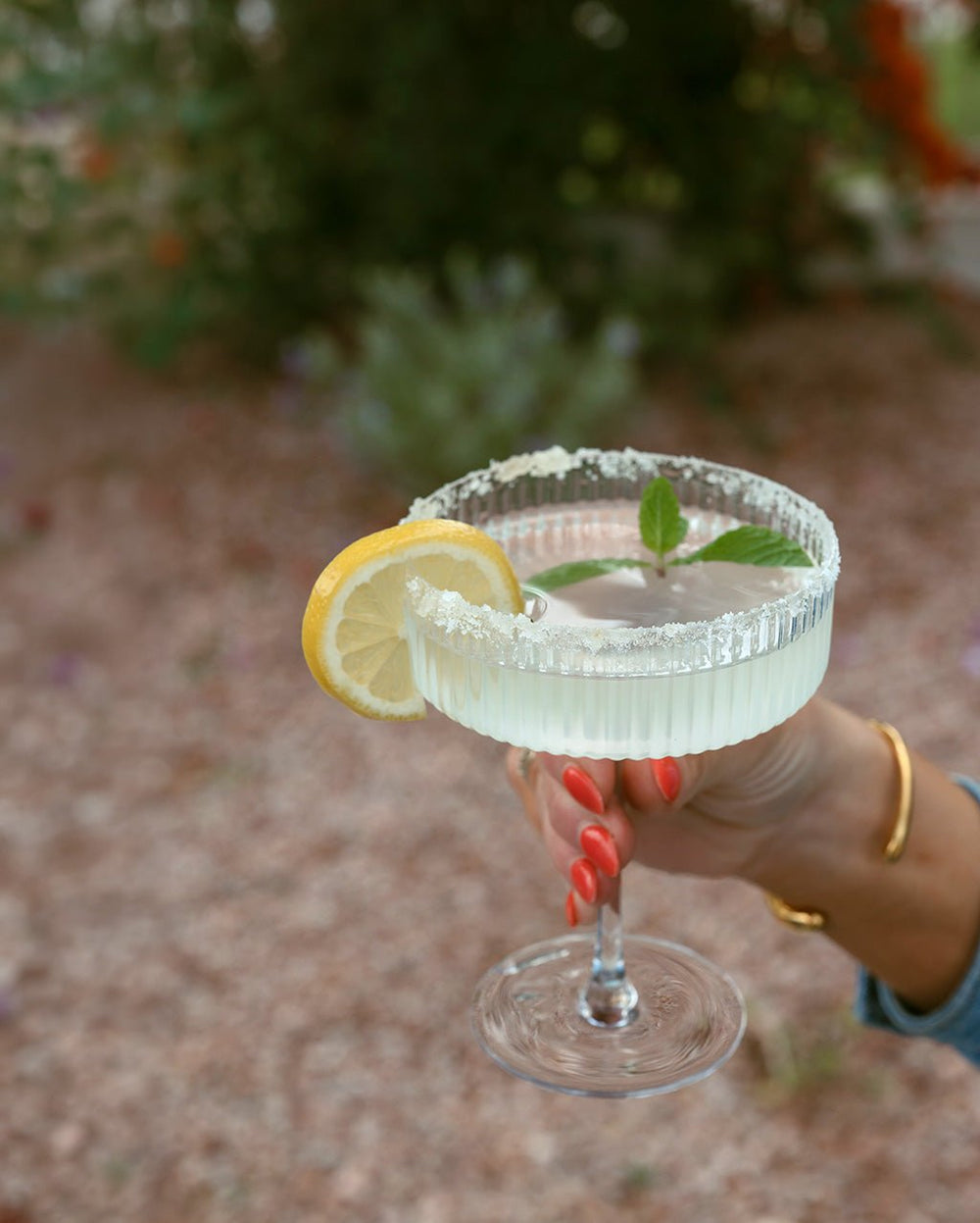 Shimmering pink cosmo martini made with a mixer cube