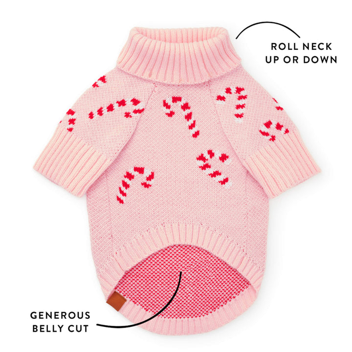 Callout of the pink candy cane sweater showing the roll neck and generous belly cut