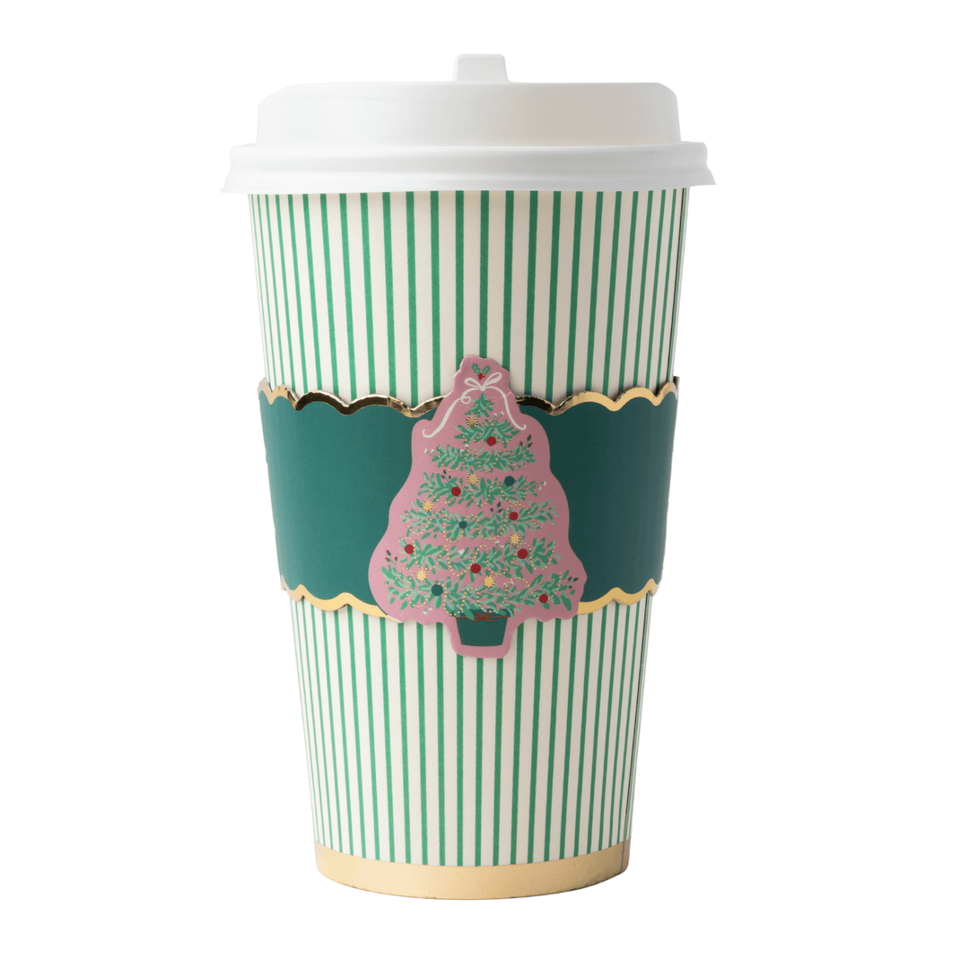 Coffee cups with green and white vertical stripes, featuring a dark green decorative band with gold trim and a pink Christmas tree illustration, on a white background.