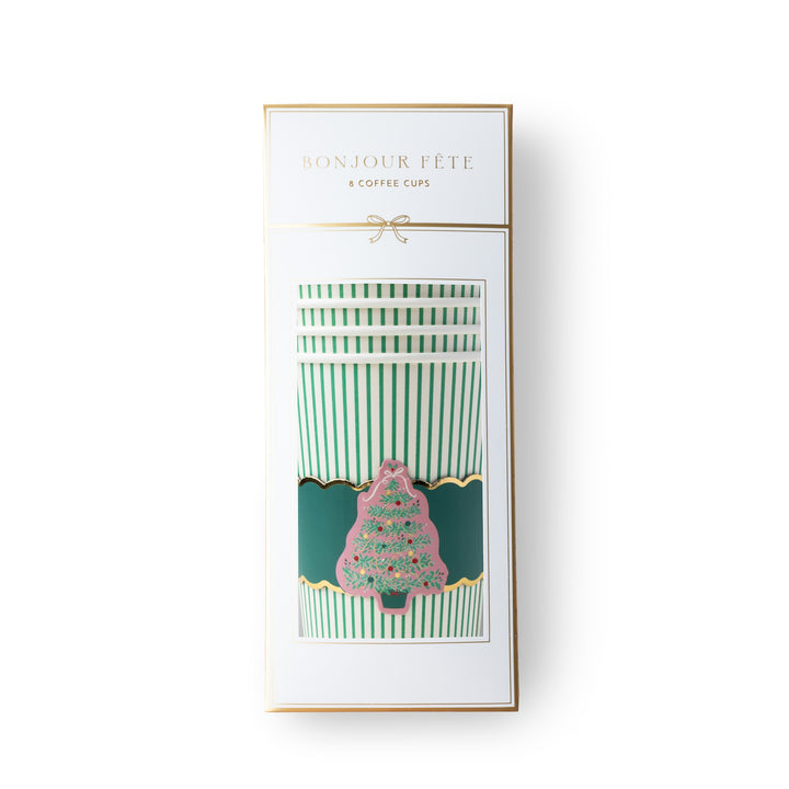 A boxed set of striped coffee cups with a pink Christmas tree design on the front, shown in its white retail packaging with gold trim and the text 'BONJOUR FÊTE & COFFEE CUPS' on a white background.