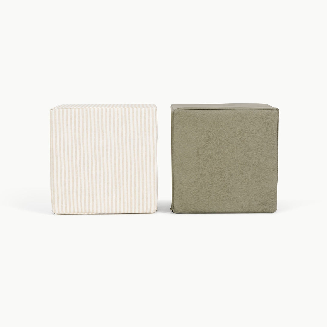 Pinstripe and olive foam play cubes side by side for toddler stacking and climbing.