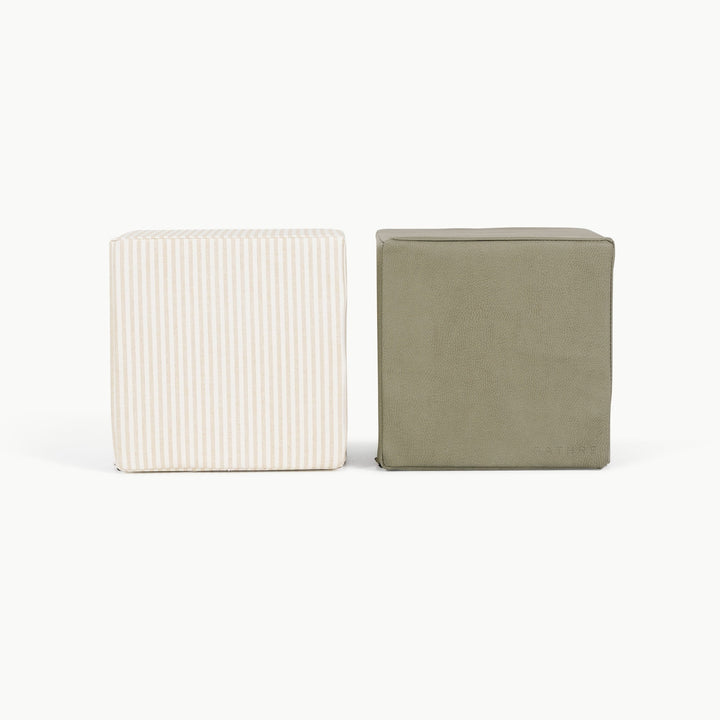 Pinstripe and olive foam play cubes side by side for toddler stacking and climbing.