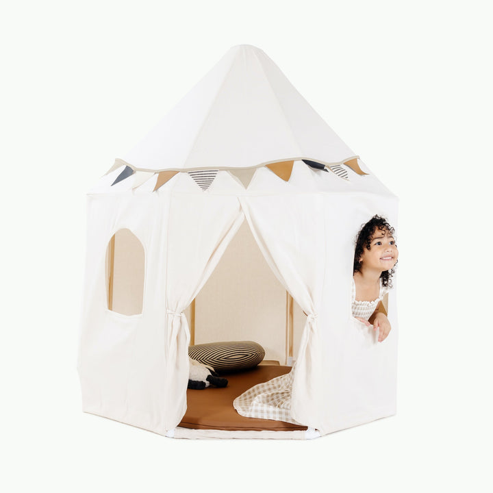Gathre canvas play tent set up as a cozy indoor hideaway.