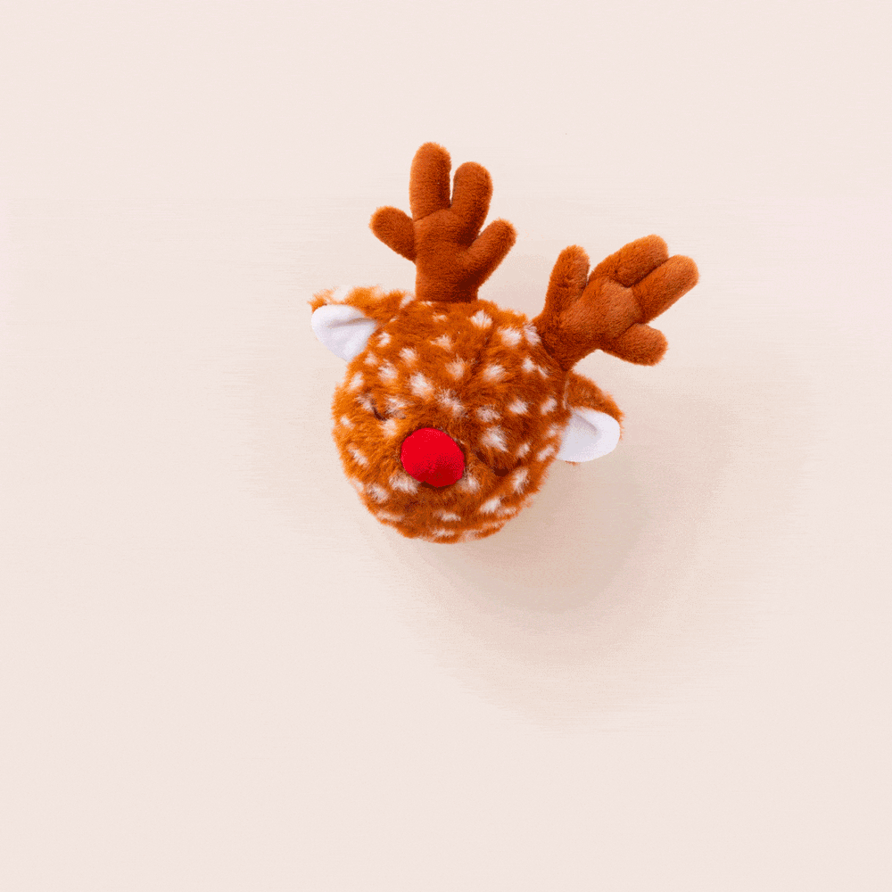 Animated clip of the spotted reindeer dog toy on a cream backdrop