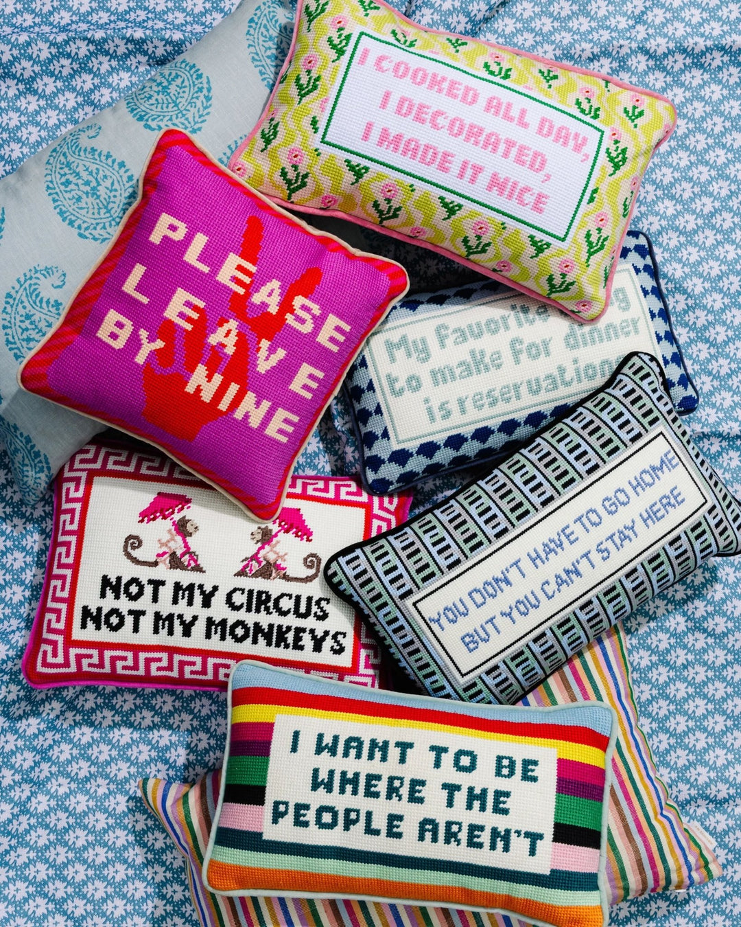 Collage of witty needlepoint throw pillows with sayings like Please Leave by Nine and Not My Circus Not My Monkeys for home decor