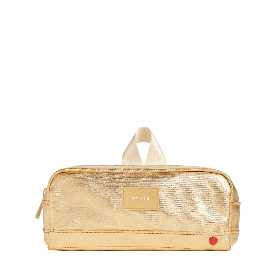 Metallic gold STATE Clinton pencil case, front view with gold patch, cream top loop, and red accent dot