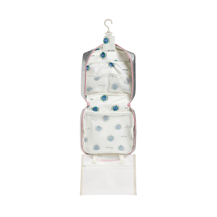 Bensen Large opened and hanging from its hook, showing printed lining, mesh pockets, and clear pouch
