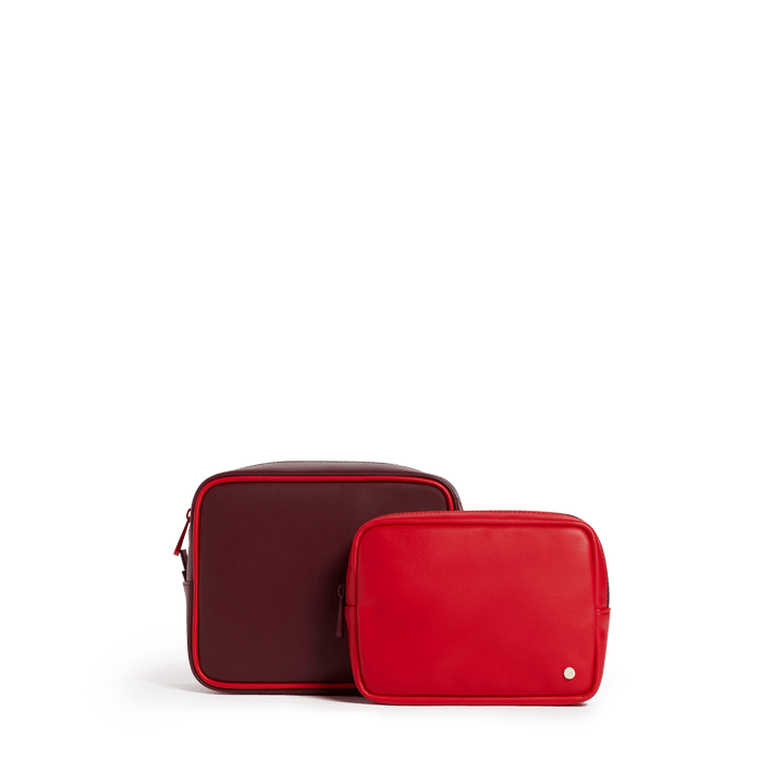 STATE travel pouch set of two side by side, large burgundy pouch and small bright red pouch