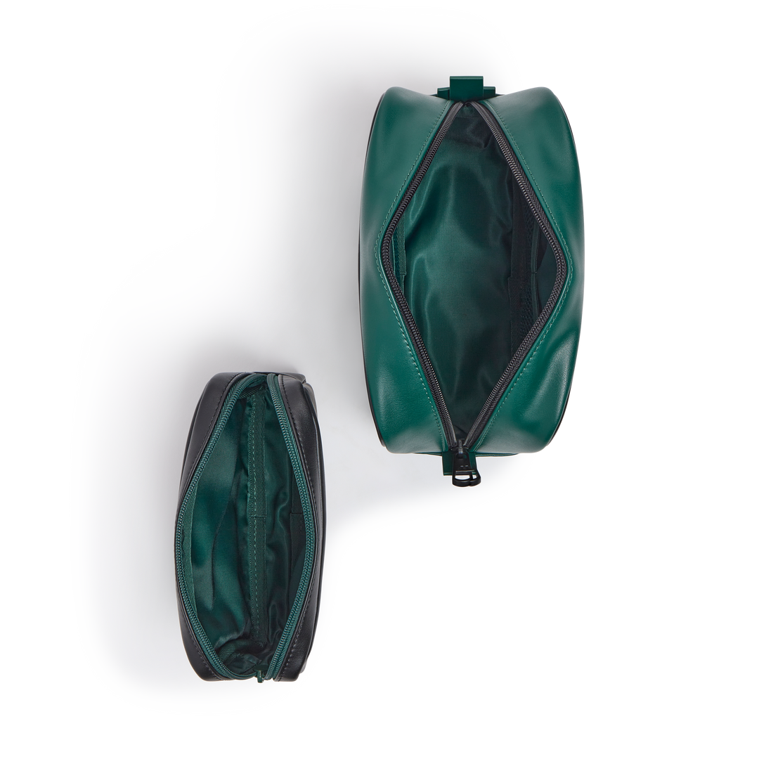 Overhead view of both pouches unzipped, showing the green interior lining