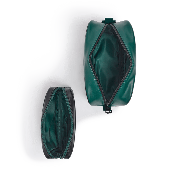 Overhead view of both pouches unzipped, showing the green interior lining