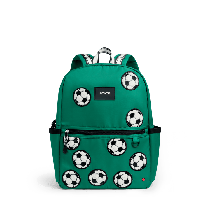 STATE Kane kids backpack in kelly green nylon with fuzzy white soccer ball patches, front view