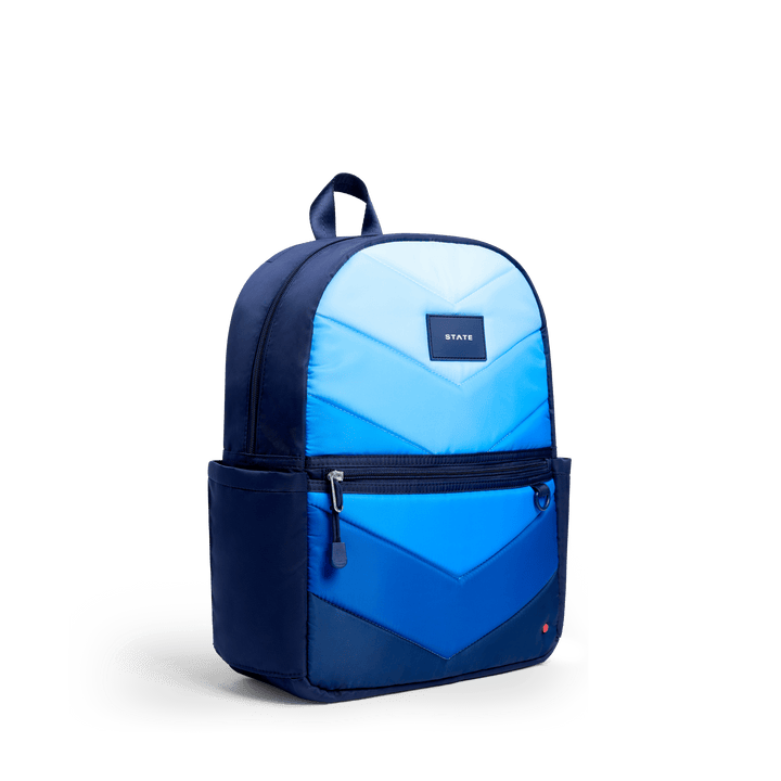 Navy Blue Chevron Kane backpack at a three-quarter angle showing the side pocket