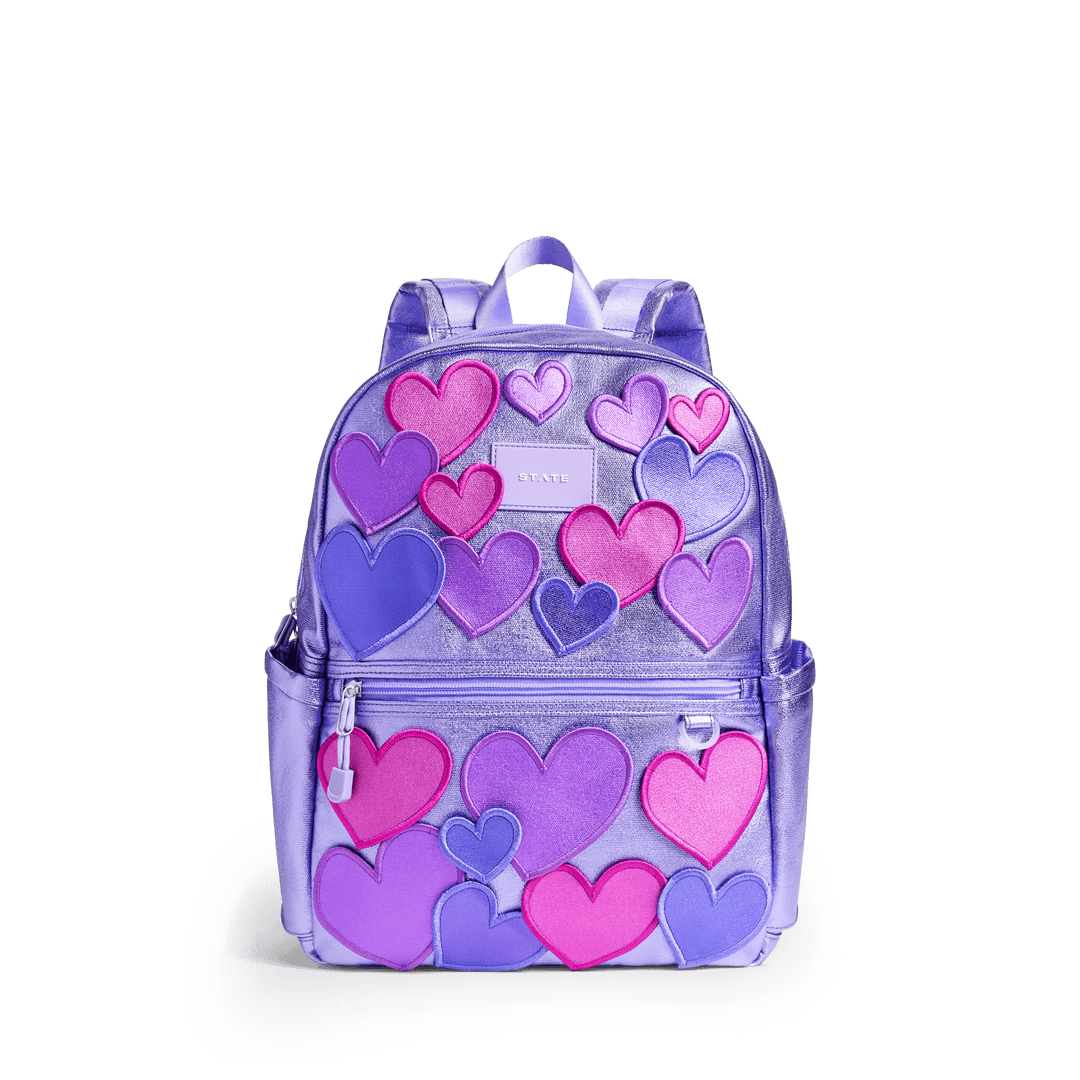 STATE Kane kids backpack in lilac metallic with raised pink, magenta, and purple 3D hearts, front view