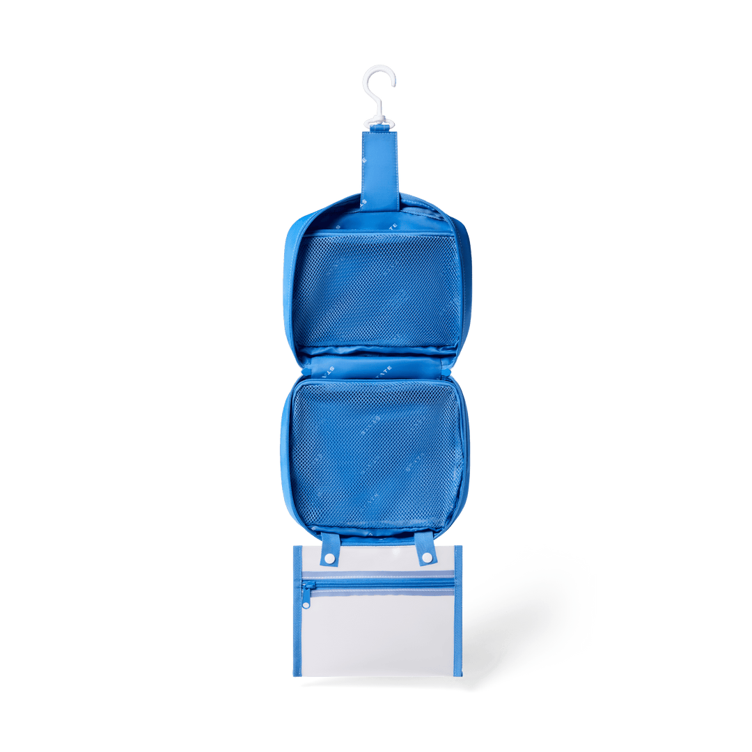 Blue Bensen opened and hanging from its hook, with blue mesh pockets and the clear snap-off pouch