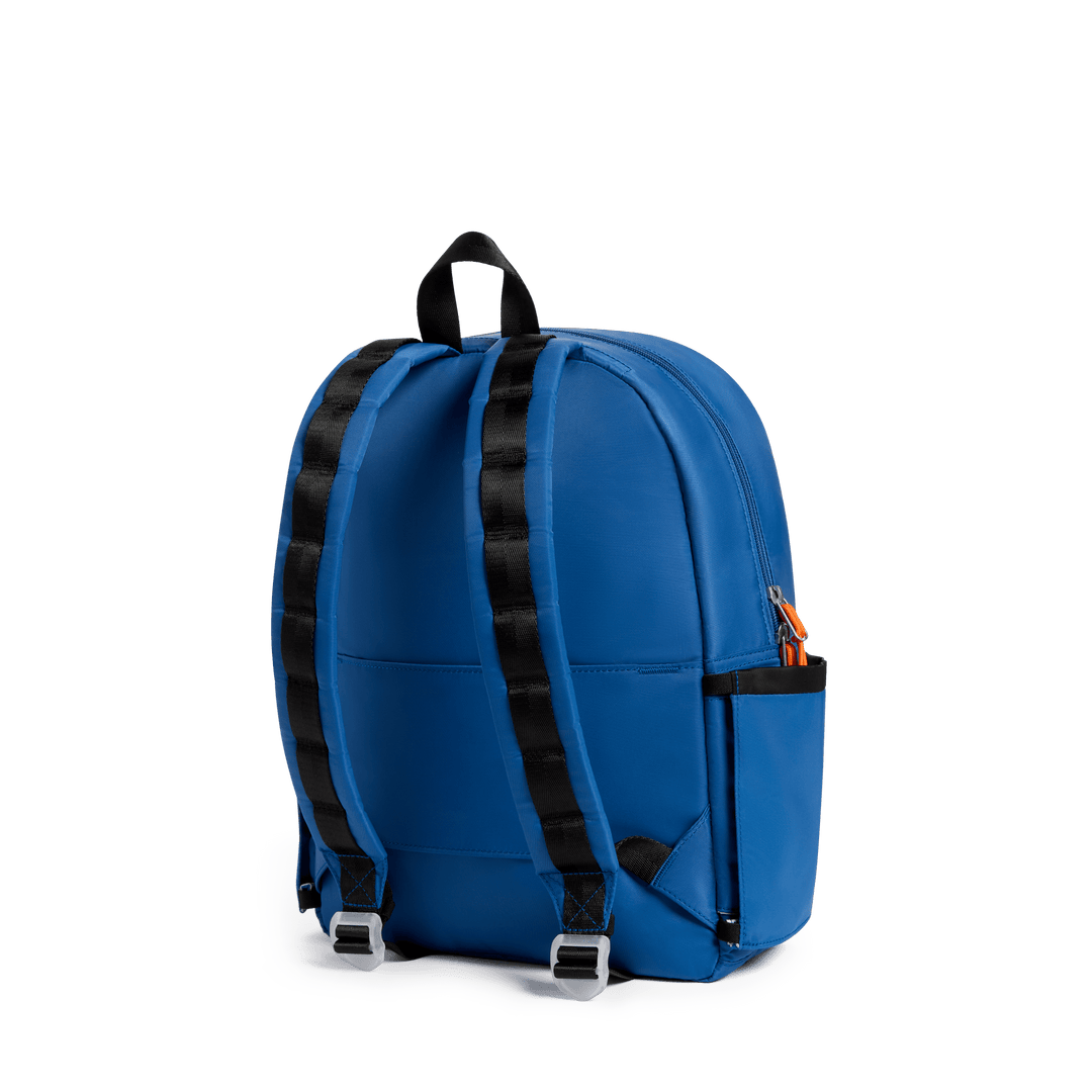 Back of the cobalt blue Dragon Kane backpack with black padded straps