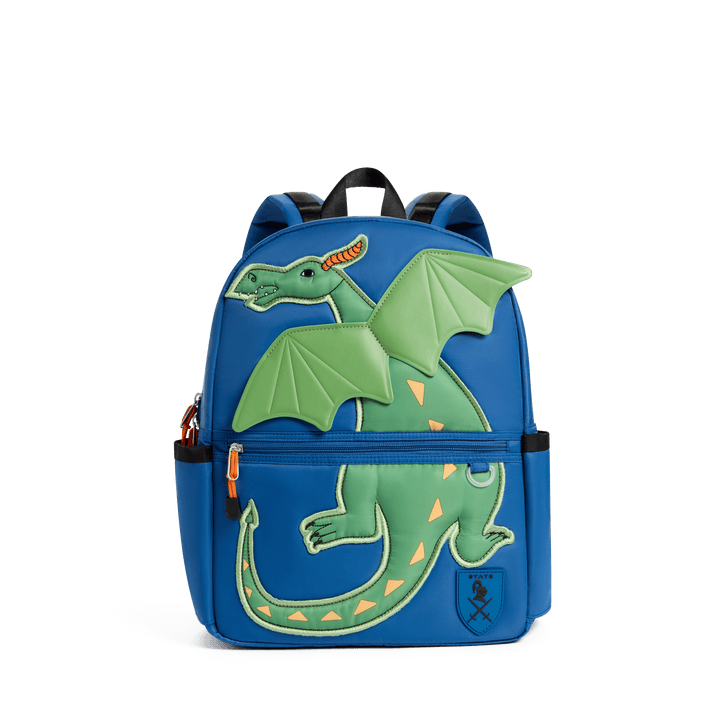 STATE Kane kids backpack in cobalt blue with a green dragon and raised wings, front view
