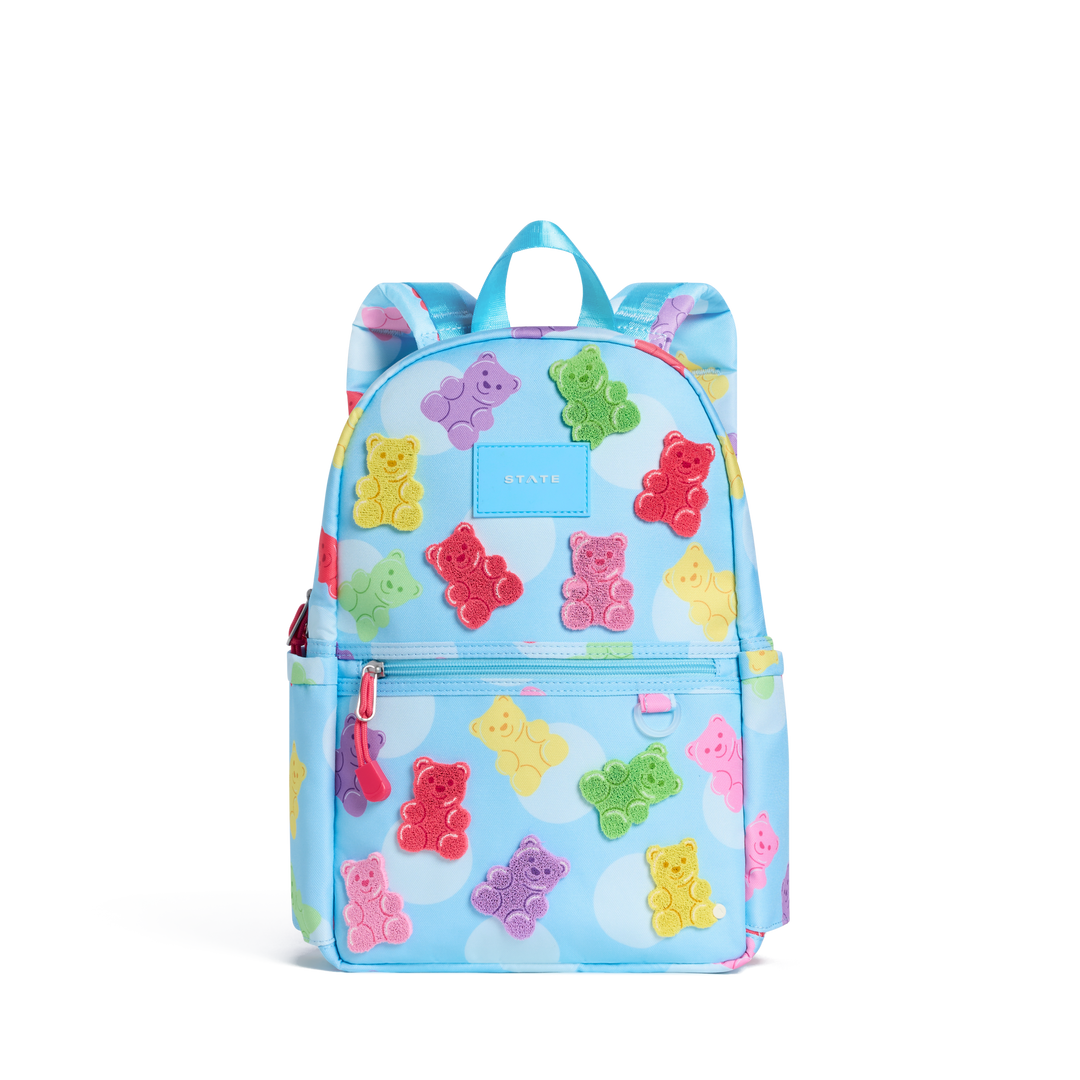 Light blue STATE Kane Mini covered in rainbow gummy bears and clouds, front view