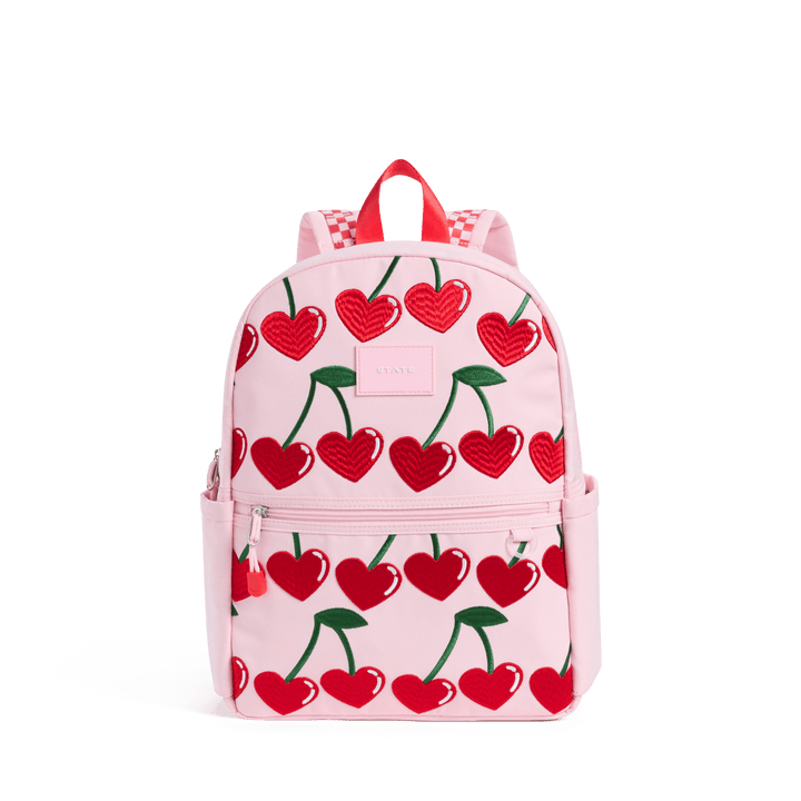 STATE Kane kids backpack in pale pink with rows of red heart-shaped cherries, front view