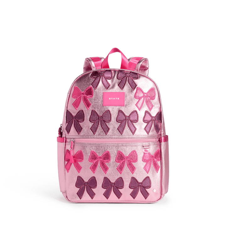 STATE Kane kids backpack in pink metallic with rows of pink and plum metallic bows, front view