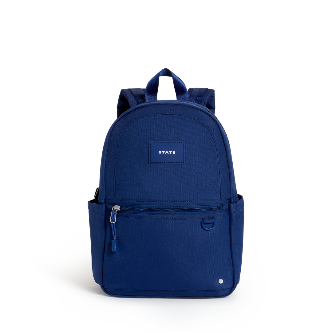 Solid navy STATE Kane Mini toddler backpack with small patch, front view