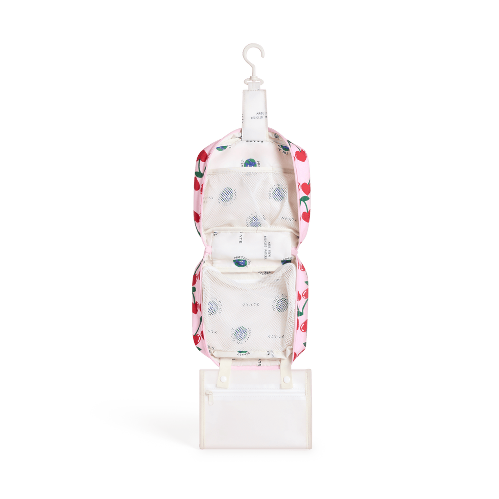 Cherry Bensen opened and hanging from its hook, with cream lining and the clear snap-off pouch