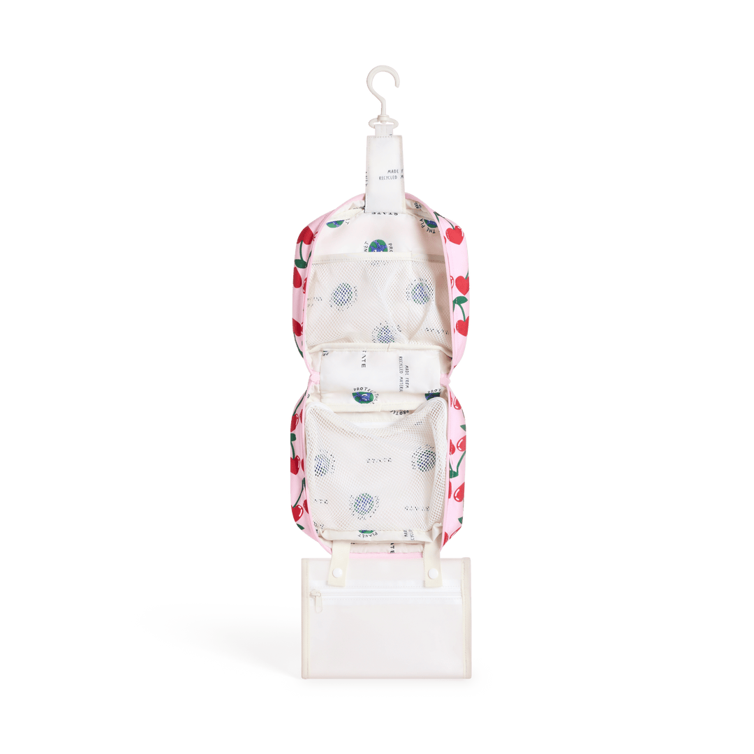 Cherry Bensen opened and hanging from its hook, with cream lining and the clear snap-off pouch
