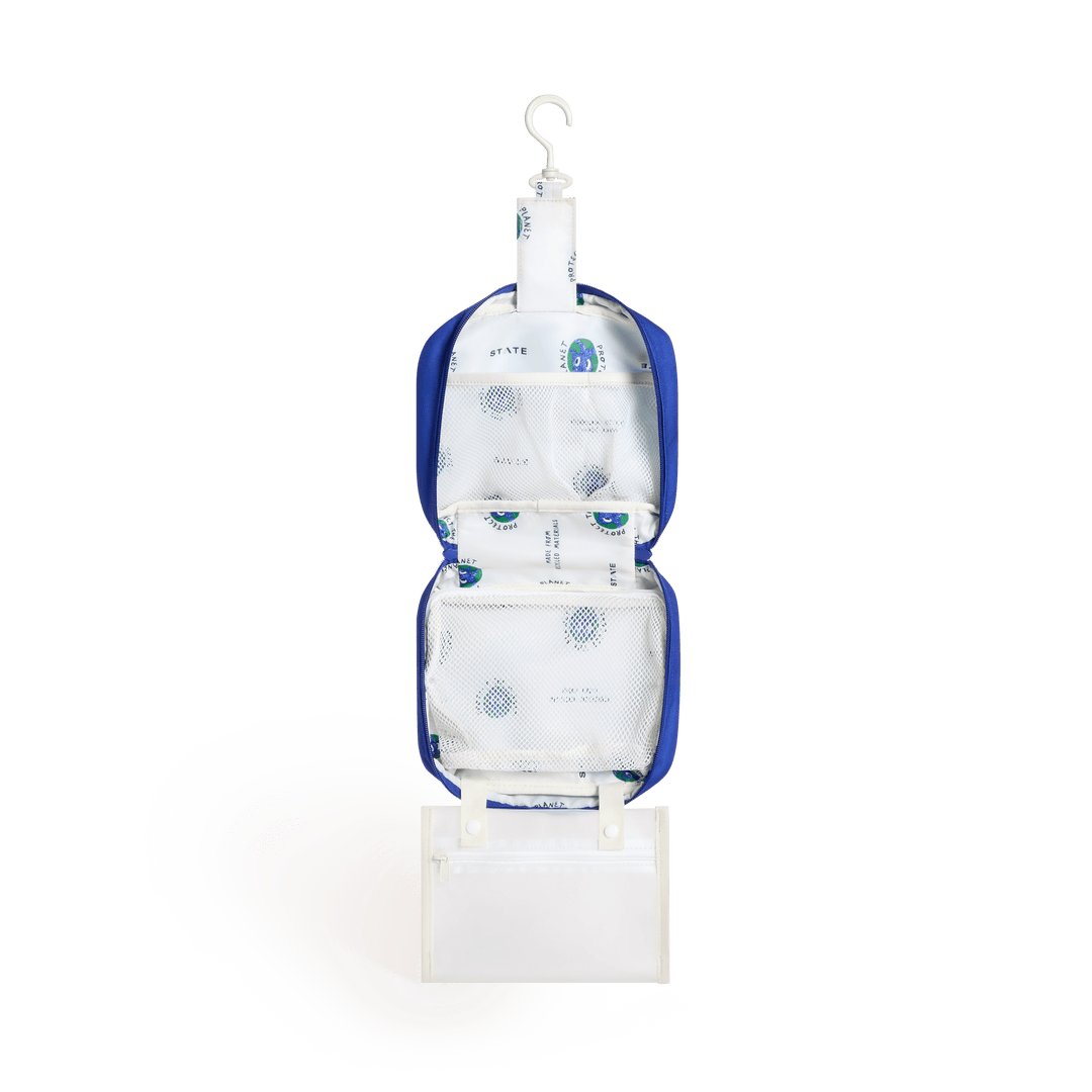 Mountains Bensen opened and hanging from its hook, showing cream lining and the clear snap-off pouch