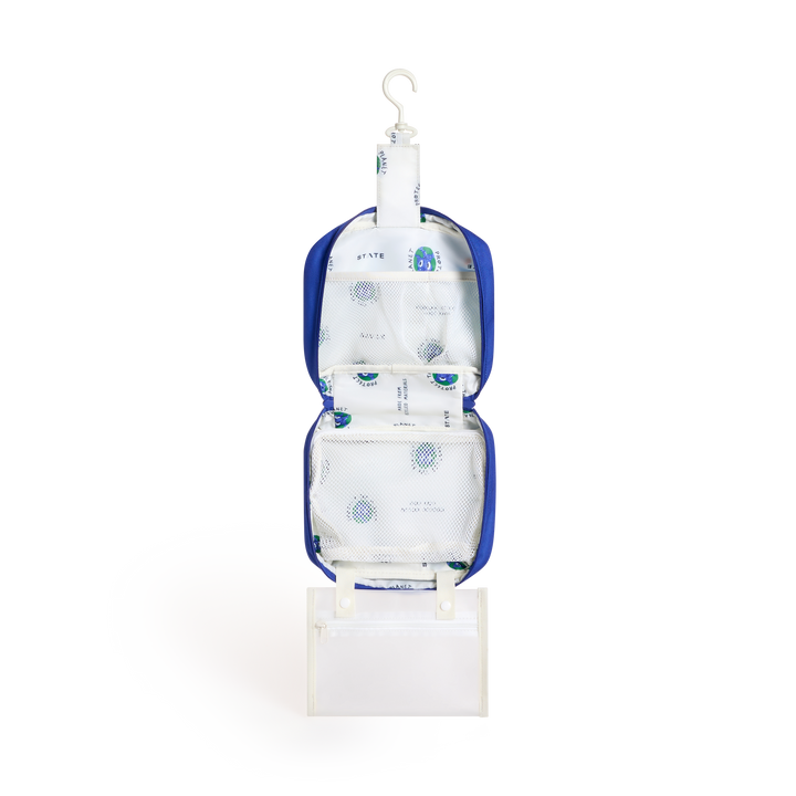 Mountains Bensen opened and hanging from its hook, showing cream lining and the clear snap-off pouch