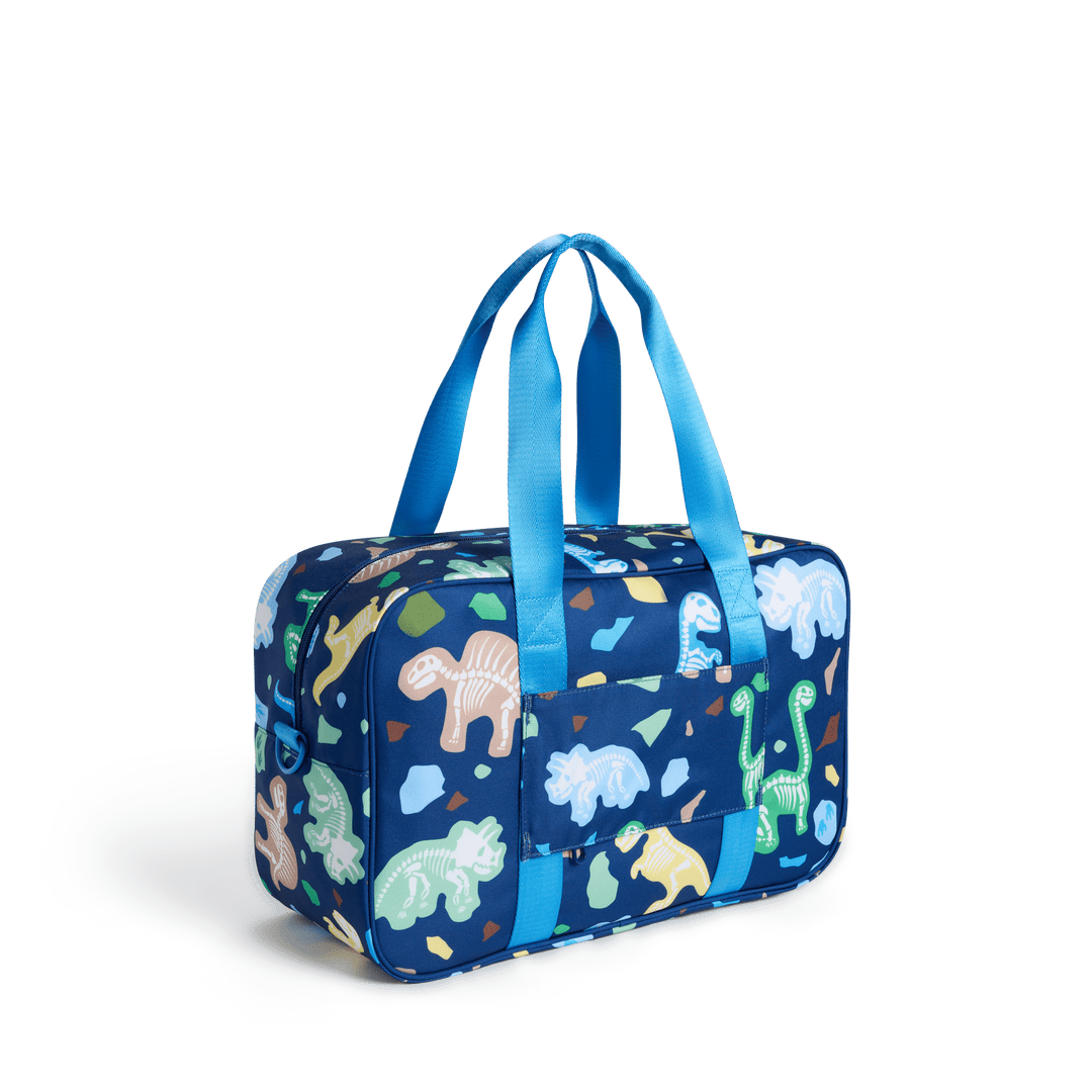 Dino Fossils Rockaway duffle from the three-quarter back angle, showing the luggage sleeve