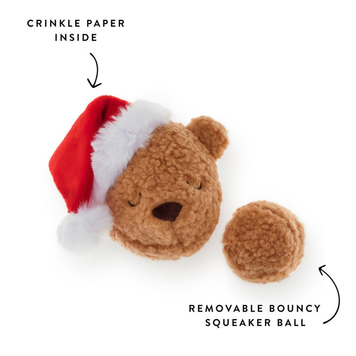 Teddy toy beside its removable tan sherpa squeaker ball, crinkle in the hat labeled