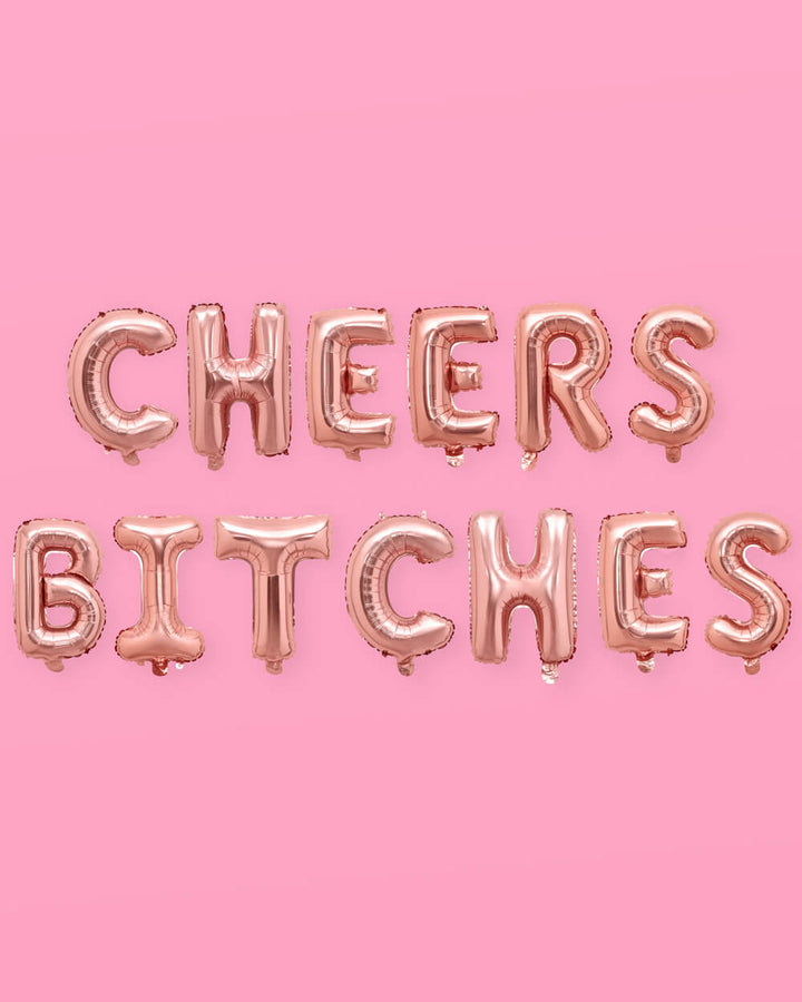 Rose gold cheers foil balloon banner for a bachelorette party