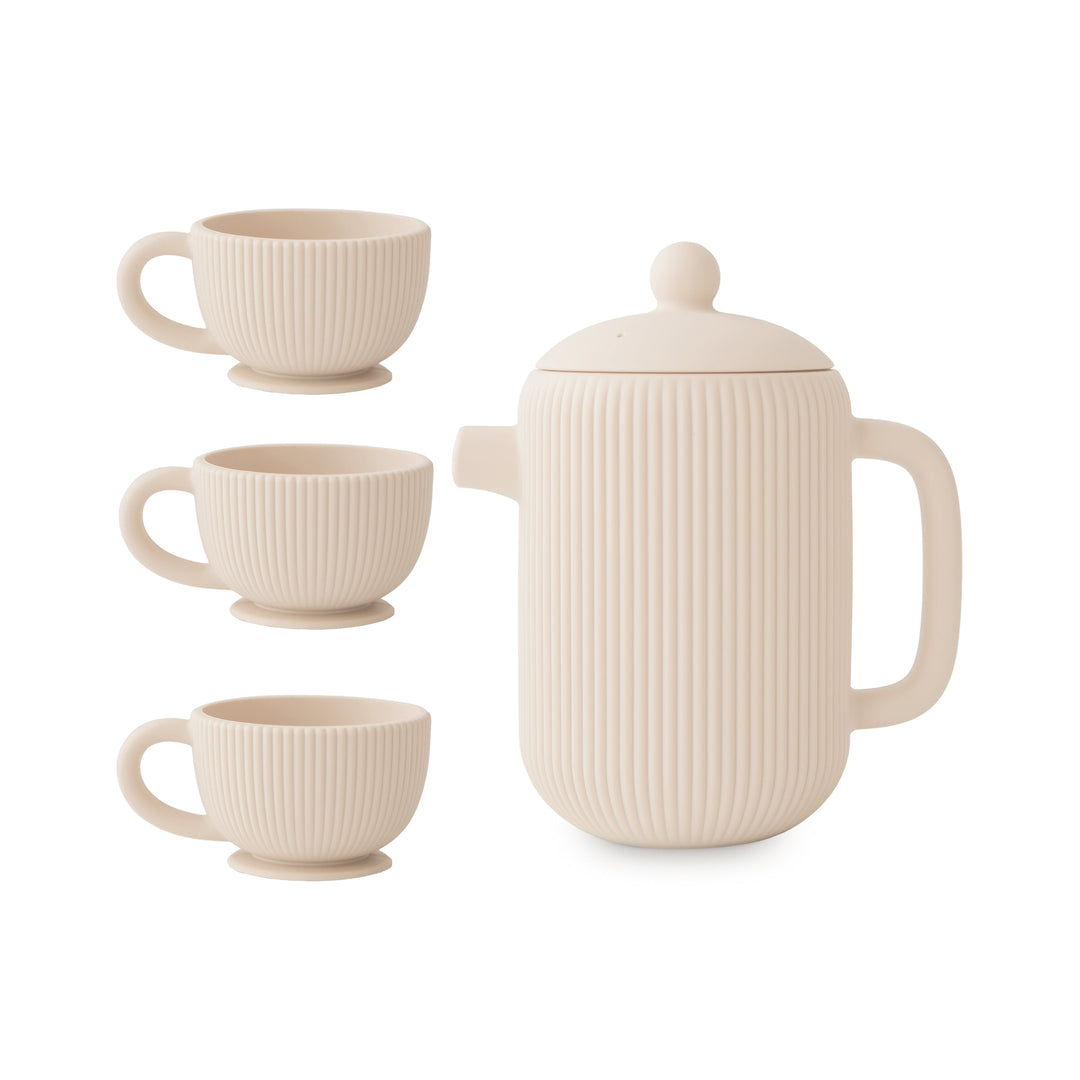 Mushie silicone tea set in shifting sand with a teapot and three cups