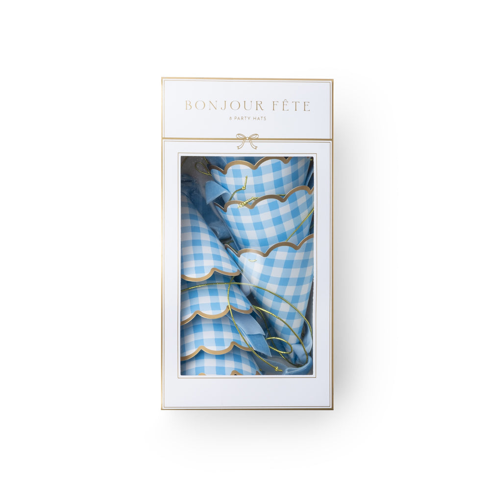 A boxed set of light blue and white gingham party hats with gold trim, presented in a white package with gold lettering reading 'BONJOUR FÉTE' and 'PARTY HATS' on a clean white background.
