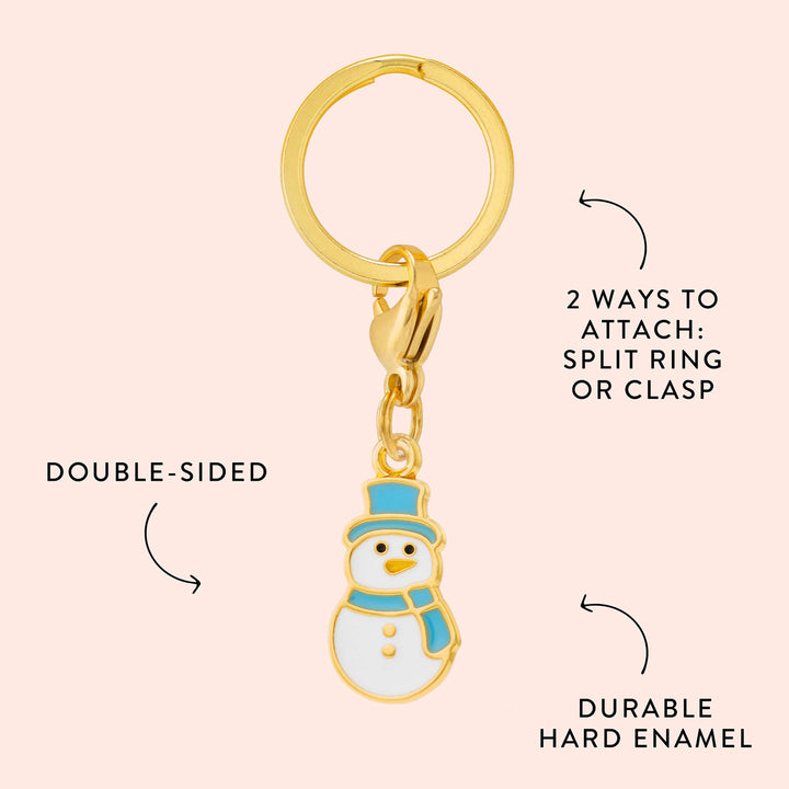 Snowman charm callout on blush noting double-sided design, hard enamel, and split ring or clasp