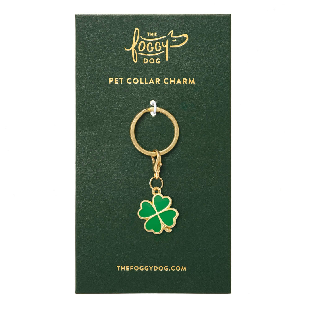 Clover charm shown on its backing card