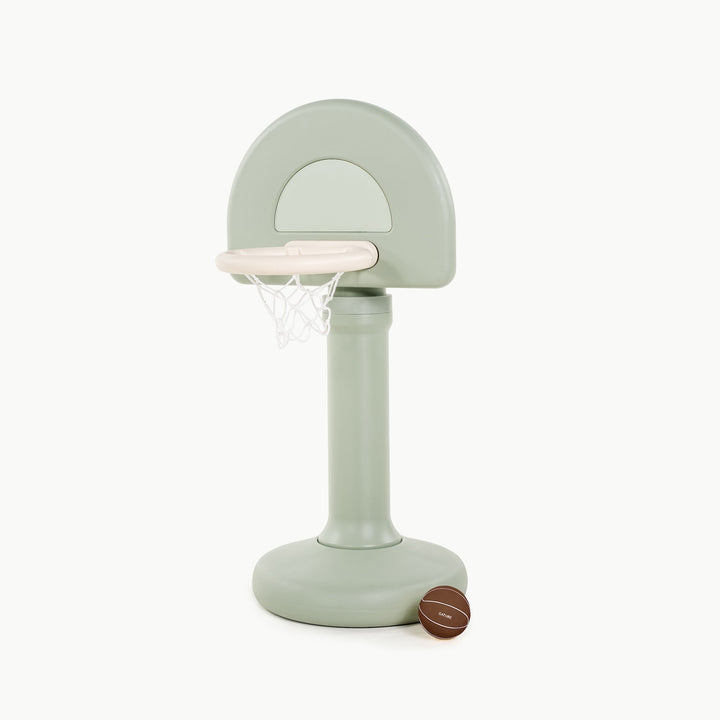 Gathre adjustable basketball hoop in palm green, front view with a basketball beside the base