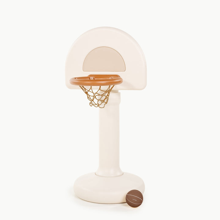 Ivory standing basketball hoop with a brown Gathre basketball resting against the weighted base