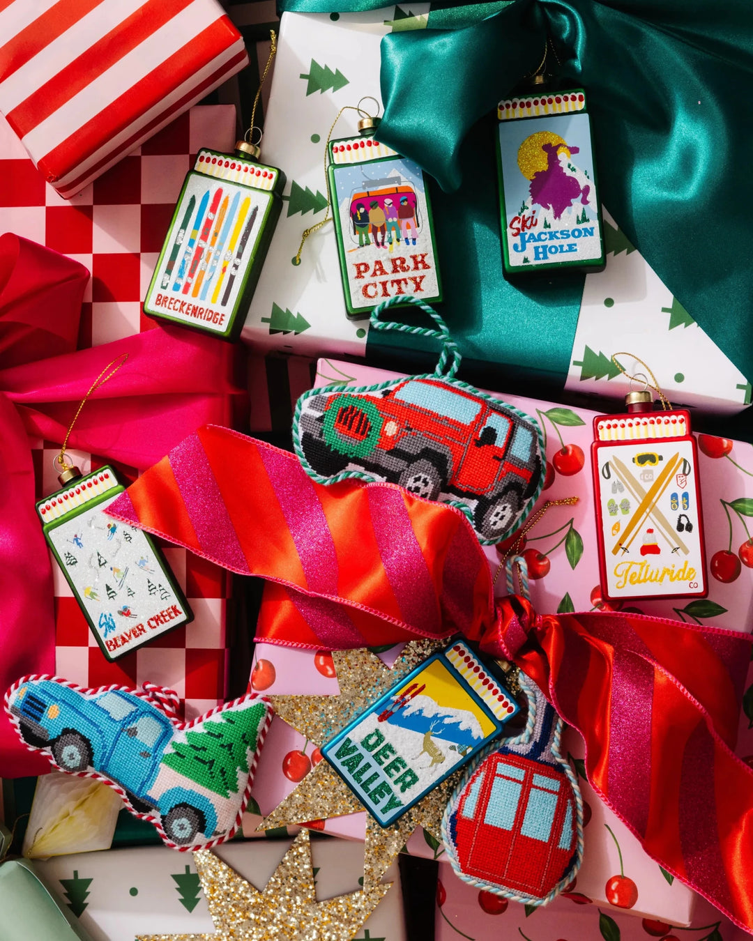 Gifts with ski and travel needlepoint ornaments, the red gondola tucked at the bottom